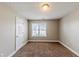 Well-lit bedroom with carpeted floors and window at 1708 Queen Victoria Ct, Locust Grove, GA 30248