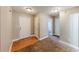 Front entry with wood flooring and carpet at 1708 Queen Victoria Ct, Locust Grove, GA 30248