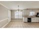 Kitchen with white cabinets and tile floor at 1708 Queen Victoria Ct, Locust Grove, GA 30248