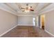 Spacious main bedroom with carpeted floors and ceiling fan at 1708 Queen Victoria Ct, Locust Grove, GA 30248