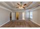 Spacious main bedroom with carpeted floors and ceiling fan at 1708 Queen Victoria Ct, Locust Grove, GA 30248