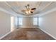 Spacious main bedroom with carpeted floors and ceiling fan at 1708 Queen Victoria Ct, Locust Grove, GA 30248