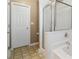 Bathroom with shower, tub, and linen closet at 2128 Mill Garden Run, Buford, GA 30519