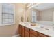 Double vanity bathroom with a large mirror at 2128 Mill Garden Run, Buford, GA 30519