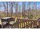 Deck with wooded views and seating at 2128 Mill Garden Run, Buford, GA 30519