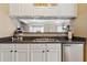 Kitchen with stainless steel appliances and dark countertops at 2128 Mill Garden Run, Buford, GA 30519