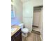 Clean bathroom with a shower/tub combo and updated flooring at 4550 Cypress Ridge Ct, Stone Mountain, GA 30083