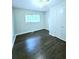 Well-lit bedroom with hardwood floors and a double door closet at 4550 Cypress Ridge Ct, Stone Mountain, GA 30083