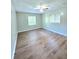 Bright bedroom with hardwood floors and two windows at 4550 Cypress Ridge Ct, Stone Mountain, GA 30083