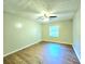 Spacious bedroom with hardwood floors and a single window at 4550 Cypress Ridge Ct, Stone Mountain, GA 30083