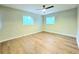 Bright bedroom with hardwood floors and two large windows at 4550 Cypress Ridge Ct, Stone Mountain, GA 30083