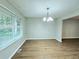 Bright dining room with hardwood floors and large window at 4550 Cypress Ridge Ct, Stone Mountain, GA 30083