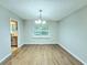 Dining room with hardwood floors and a chandelier at 4550 Cypress Ridge Ct, Stone Mountain, GA 30083