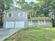 Two-car garage and front porch with landscaping at 4550 Cypress Ridge Ct, Stone Mountain, GA 30083