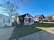 White bungalow with overgrown vines and graffiti, needing renovation at 654 English Nw Ave, Atlanta, GA 30318