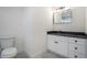 Modern bathroom with dark vanity and tile flooring at 862 Hobson Sw St, Atlanta, GA 30310