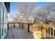 Spacious wooden deck with treetop views and a wooden railing at 862 Hobson Sw St, Atlanta, GA 30310