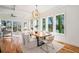 Bright dining room with hardwood floors, a live-edge table, and modern light fixture at 862 Hobson Sw St, Atlanta, GA 30310