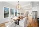 Modern dining room with hardwood floors and a stunning light fixture at 862 Hobson Sw St, Atlanta, GA 30310