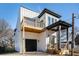 Two-story home with modern farmhouse exterior, balcony, and attached garage at 862 Hobson Sw St, Atlanta, GA 30310