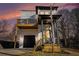 Two-story modern farmhouse at sunset, balcony, and landscaped yard at 862 Hobson Sw St, Atlanta, GA 30310