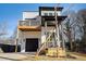 Two-story modern farmhouse with balcony, driveway, and landscaped yard at 862 Hobson Sw St, Atlanta, GA 30310