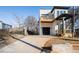 Two-story modern farmhouse with a balcony, driveway, and landscaped yard at 862 Hobson Sw St, Atlanta, GA 30310