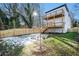 Back of house showing two-story home with deck and fenced yard at 862 Hobson Sw St, Atlanta, GA 30310