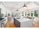 Open concept kitchen with large island and stainless steel appliances at 862 Hobson Sw St, Atlanta, GA 30310