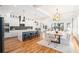 Open concept kitchen and dining area with island seating and hardwood floors at 862 Hobson Sw St, Atlanta, GA 30310