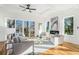 Spacious living room featuring hardwood floors, a fireplace, and ample natural light at 862 Hobson Sw St, Atlanta, GA 30310