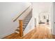 Elegant staircase with wood railing and hardwood floors at 862 Hobson Sw St, Atlanta, GA 30310