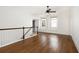 Spacious loft area with hardwood floors and ceiling fan at 1648 Beacon Hill Ne Blvd, Atlanta, GA 30329