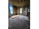 Large bedroom with two windows, ready for renovation at 1777 Yellow Nw St, Conyers, GA 30012