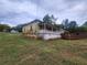 Slightly elevated view of a green house with porch at 1777 Yellow Nw St, Conyers, GA 30012