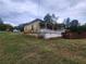 Slightly elevated view of a green house with porch at 1777 Yellow Nw St, Conyers, GA 30012