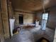 Under renovation, this room shows original wood walls at 1777 Yellow Nw St, Conyers, GA 30012
