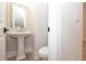 Small powder room with pedestal sink and classic design at 550 Fisher Dr # 47, Alpharetta, GA 30009