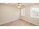 Bright basement bedroom with hardwood floors and two large windows at 550 Fisher Dr # 47, Alpharetta, GA 30009