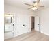 Upstairs bedroom with ensuite bath access and double doors to a large closet at 550 Fisher Dr # 47, Alpharetta, GA 30009