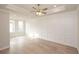 Spacious bedroom with hardwood floors and wainscoting at 550 Fisher Dr # 47, Alpharetta, GA 30009