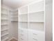 Large walk-in closet with shelving and drawers at 550 Fisher Dr # 47, Alpharetta, GA 30009