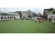 Community lawn with people enjoying outdoor games and activities at 550 Fisher Dr # 47, Alpharetta, GA 30009