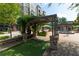 Relaxing pergola with seating area and putting green in a plaza setting at 550 Fisher Dr # 47, Alpharetta, GA 30009