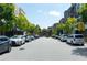 Residential street with parked cars and lush trees along the roadside at 550 Fisher Dr # 47, Alpharetta, GA 30009