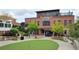 Brick restaurant building with outdoor seating and a putting green at 550 Fisher Dr # 47, Alpharetta, GA 30009