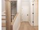 Modern staircase with light oak wood and black metal railing at 550 Fisher Dr # 47, Alpharetta, GA 30009