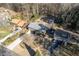 Aerial view of a house and surrounding properties, showcasing a wooded setting at 2500 Cottonwood Dr, Marietta, GA 30066