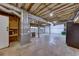 Unfinished basement with double garage doors and high ceilings at 2500 Cottonwood Dr, Marietta, GA 30066