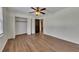 Bedroom with hardwood floors, closet, and ceiling fan at 2500 Cottonwood Dr, Marietta, GA 30066